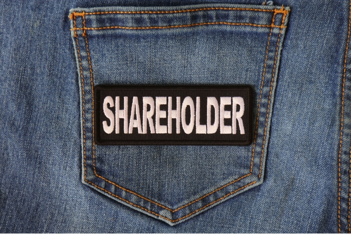 Shareholder Patch shown on jeans