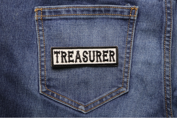 Treasurer Patch Black On White shown on jeans