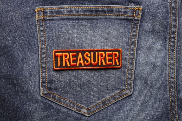 Treasurer Patch 3.5 Inch Orange shown on jeans
