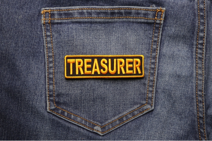 Treasurer Patch shown on jeans