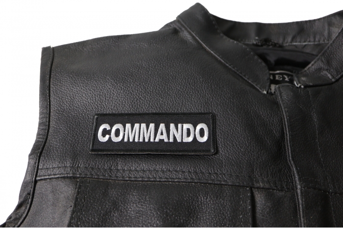Commando Patch - 4x1.5 inch. Embroidered Iron on Patch shown on leather vest