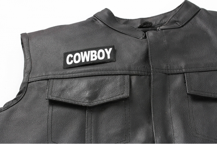 Cowboy Patch - 3.5x1.5 inch. Embroidered Iron on Patch shown on leather vest