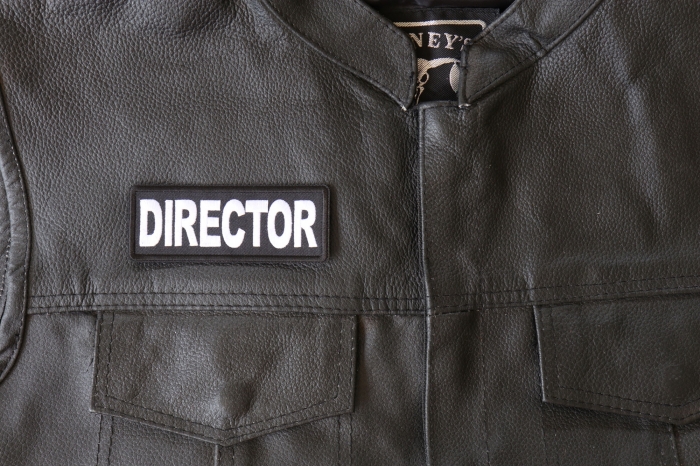 Director Patch - 4x1.5 inch - Embroidered Iron on Patch shown on leather vest