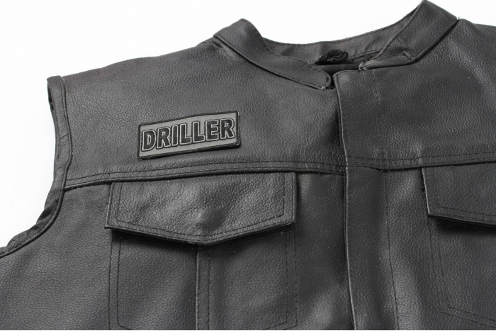 Driller Patch - Iron on Patch - 3x1.5 inch shown on leather vest