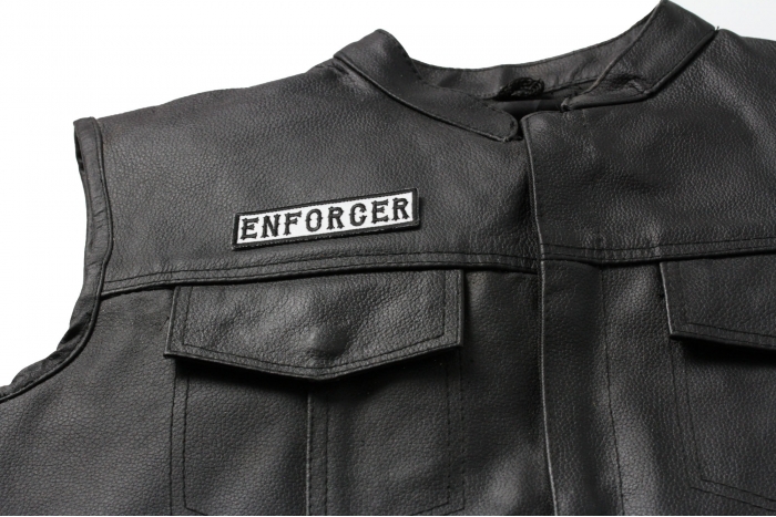 Enforcer Patch Black On White - Iron on Patch - 3.5x1 inch shown on leather vest