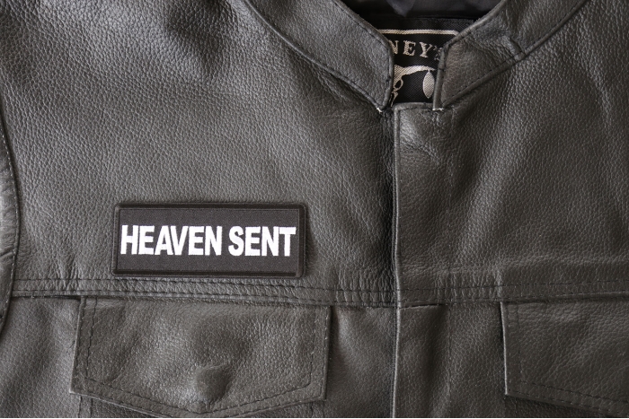 Heaven Sent Patch - 4x1.5 inch - Embroidered Iron on Patch shown on leather vest