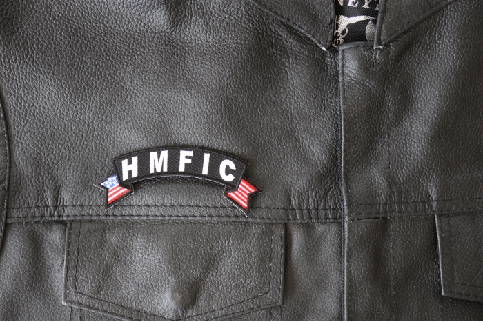 HMFIC Small Flag Rocker Patch - 4x1.5 inch - Embroidered Iron on Patch shown on leather vest