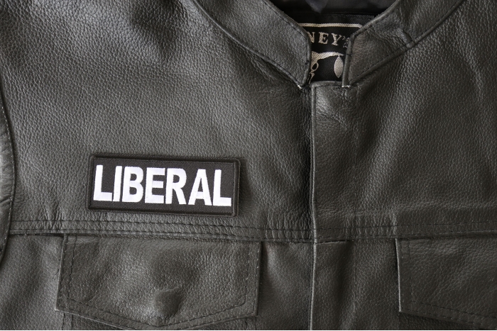 Liberal Patch - 4x1.5 inch - Embroidered Iron on Patch shown on leather vest