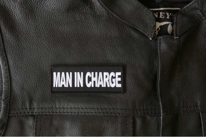 Man in Charge Patch - 4x1.5 inch - Embroidered Iron on Patch shown on leather vest