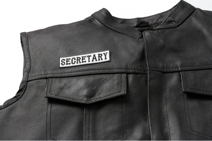 Secretary Patch Black On White - Iron on Patch - 3.5x1 inch shown on leather vest