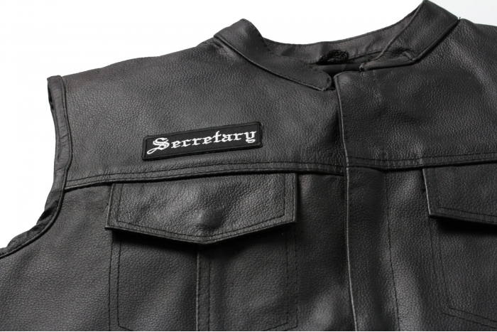 Secretary Patch In Old English - Iron on Patch - 3.5x1 inch shown on leather vest