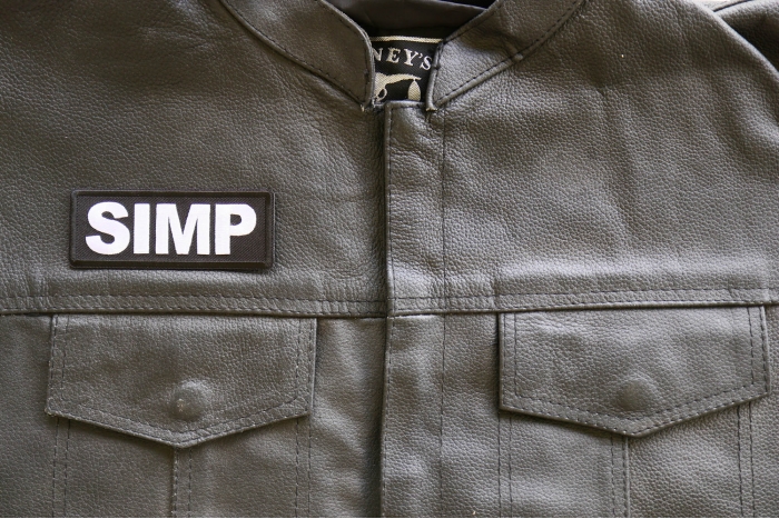 Simp Iron on Patch shown on leather vest