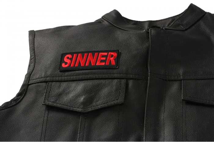 Sinner Patch - 4x1.5 inch. Embroidered Iron on Patch shown on leather vest