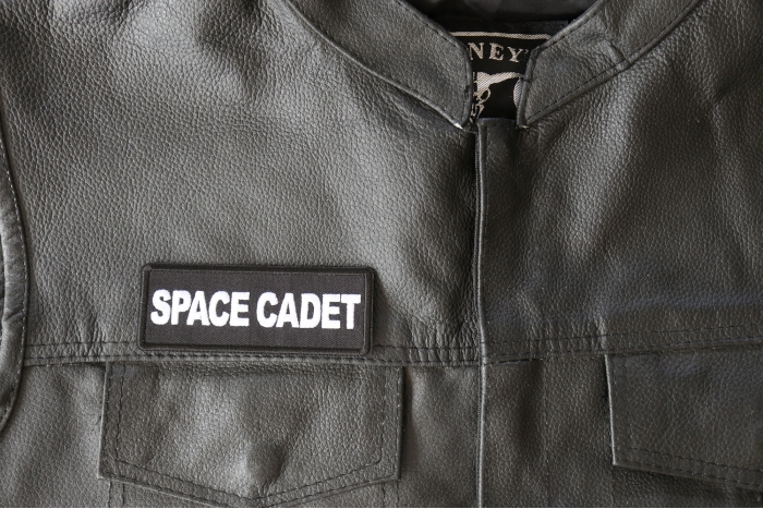 Space Cadet Patch - 4x1.5 inch - Embroidered Iron on Patch shown on leather vest