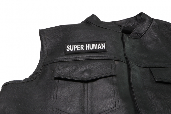 Super Human Patch - 4x1.5 inch. Embroidered Iron on Patch shown on leather vest