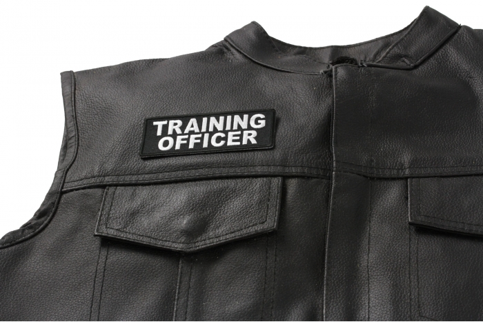 Training Officer Patch - 4x1.5 inch Embroidered Iron on Patch shown on leather vest