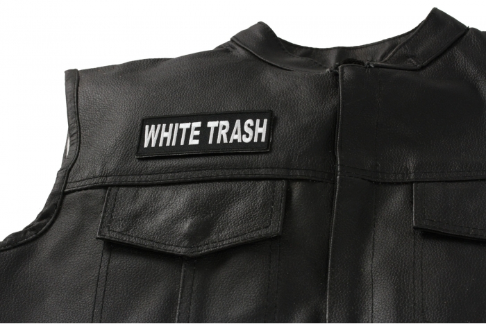 White Trash Patch - 4x1.5 inch. Embroidered Iron on Patch shown on leather vest