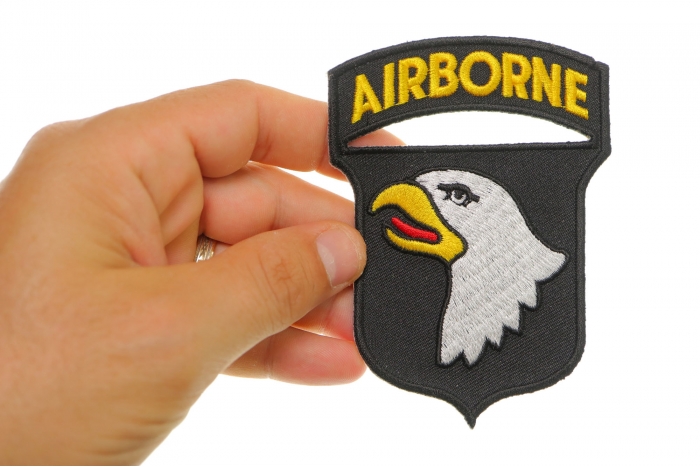 101st Airborne Patch shown on hand for size comparison