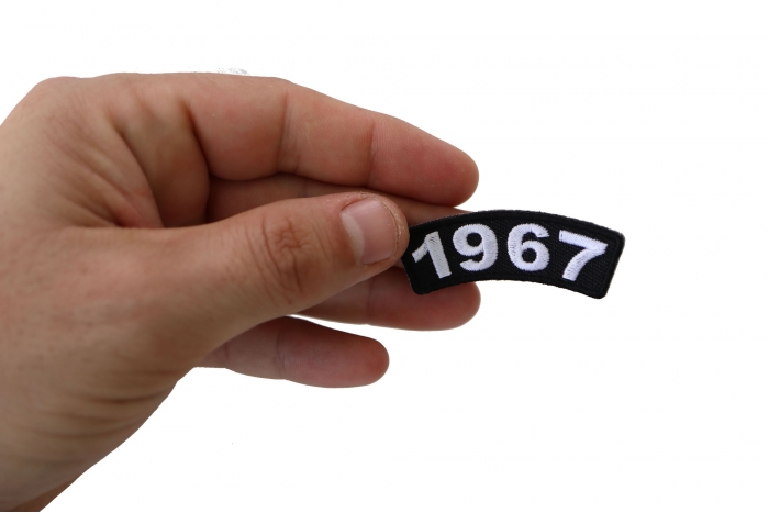 1967 Year Patch shown on hand for size comparison