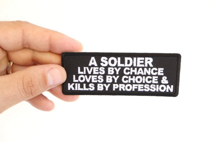 A Soldier Lives By Chance Loves By Choice and Kills by Profession Patch shown on hand for size comparison