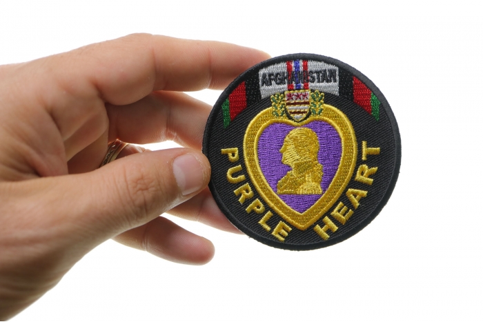 Afghanistan Purple Heart Patch shown on hand for size comparison