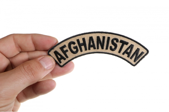 Afghanistan Small Arm Rocker Patch shown on hand for size comparison