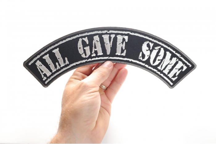 All Gave Some Patch, Large Rocker Patches shown on hand for size comparison