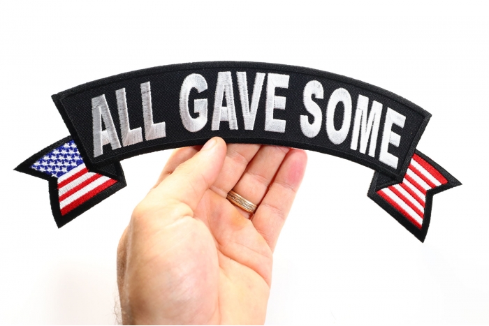 All Gave Some Patch, US Flag Large Rocker Patch shown on hand for size comparison