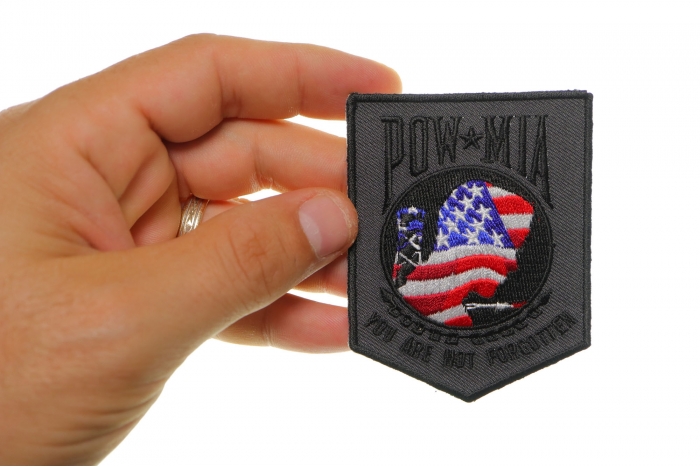 American Flag POW MIA Patch shown on hand for size comparison