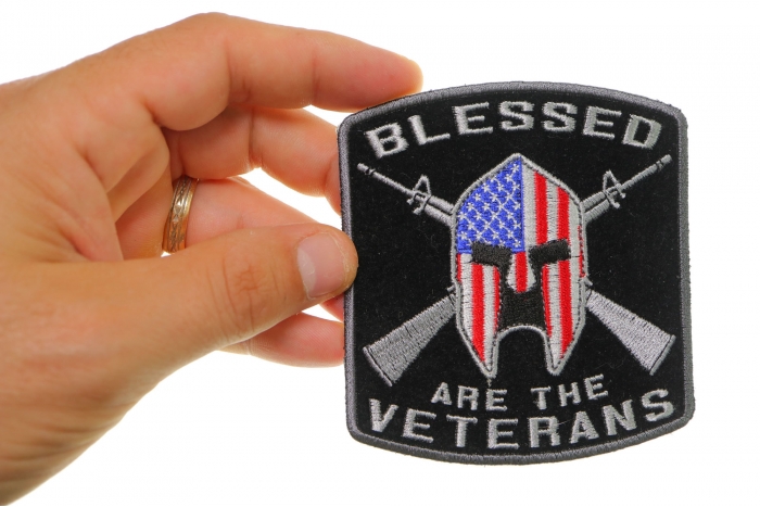 Blessed Are The Veterans American Flag Spartan Patch shown on hand for size comparison