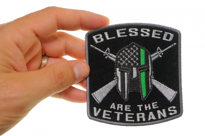 Blessed Are The Veterans Iron on Patch shown on hand for size comparison
