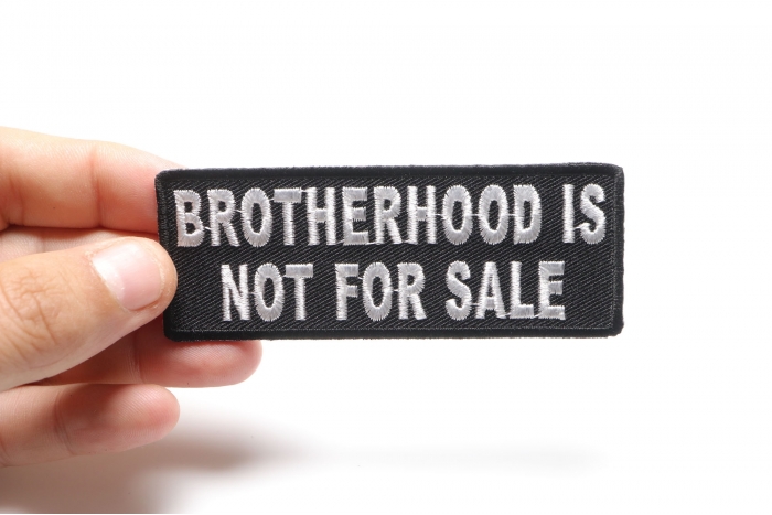 Brotherhood Is Not For Sale Patch, Patriotic Saying Patches shown on hand for size comparison