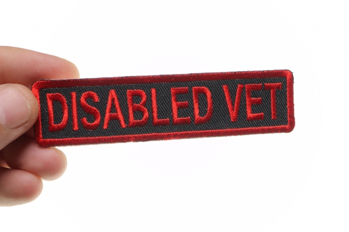 Disabled Vet Patch shown on hand for size comparison