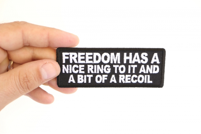 Freedom Has a Nice Ring To It and a Bit of a Recoil Patch, Funny Saying Patches shown on hand for size comparison