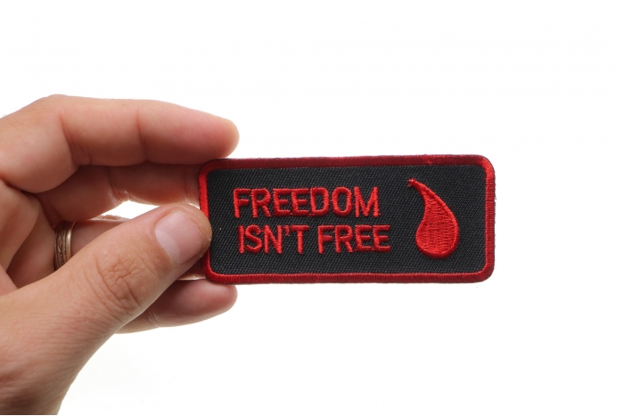 Freedom Isn't Free Blood Drop Patch shown on hand for size comparison