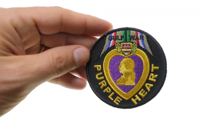 Gulf War Purple Heart Iron on Patch shown on hand for size comparison