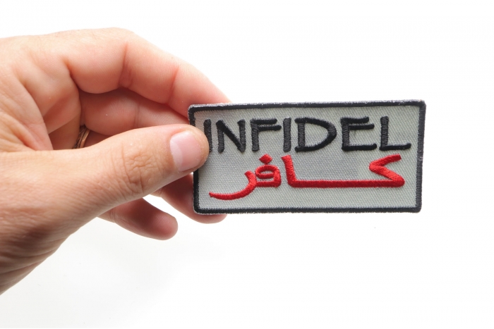 Infidel Patch Over Desert Sand shown on hand for size comparison