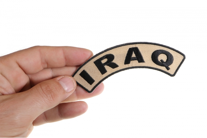 Iraq Small Arm Rocker Patch shown on hand for size comparison
