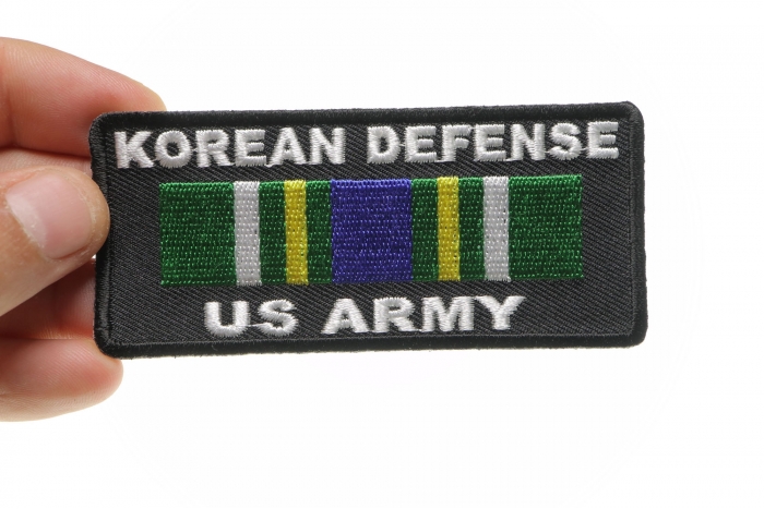 Korean Defense US Army Patch shown on hand for size comparison