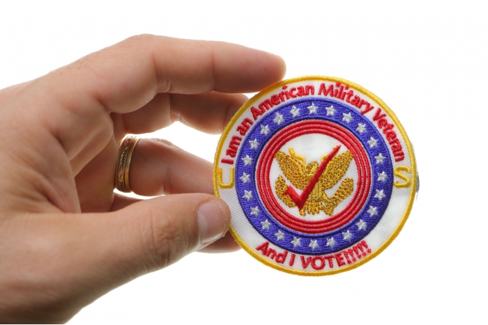 I am an American Military Veteran and I Vote Iron on Patch shown on hand for size comparison