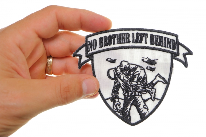 No Brother Left Behind Small Iron on Patch shown on hand for size comparison
