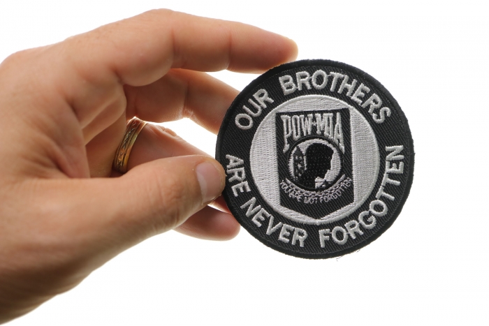 Our Brothers Are Never Forgotten Patch Small shown on hand for size comparison