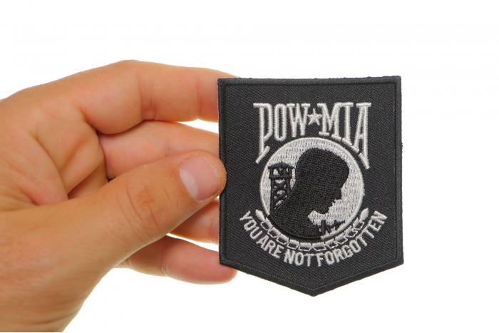 POW MIA Patch Black White shown on hand for size comparison