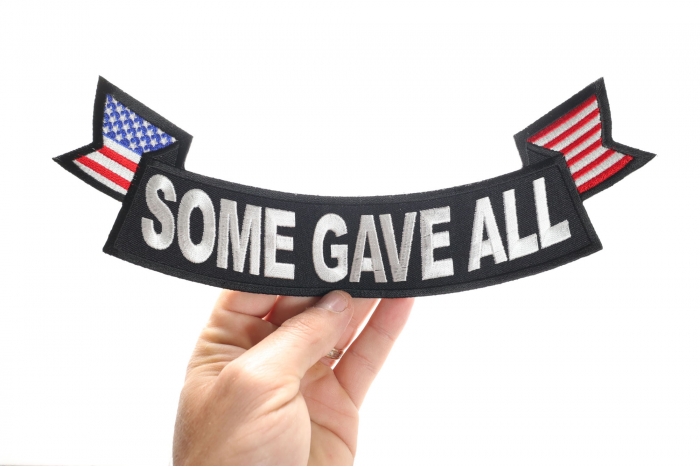 Some Gave All Patch, US Flag Large Rocker Patch shown on hand for size comparison