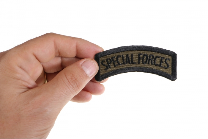 Special Forces Patch shown on hand for size comparison