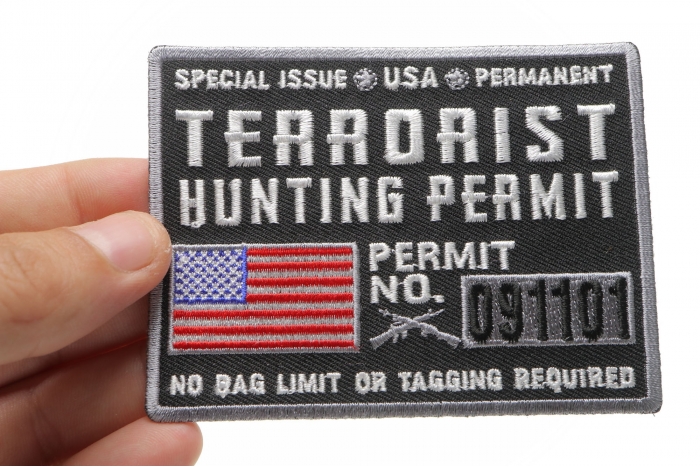 Terrorist Hunting Permit Funny Military Morale Patch shown on hand for size comparison