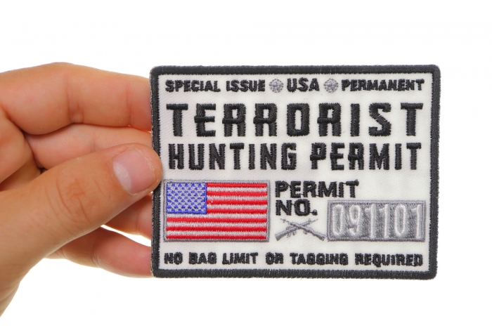 Terrorist Hunting Permit White Patch shown on hand for size comparison