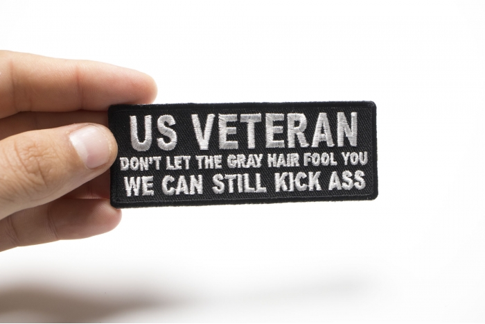 US VETERAN Don't Let the Gray Hair Fool You We Can Still Kick Ass Patch, Military Vet Patches shown on hand for size comparison