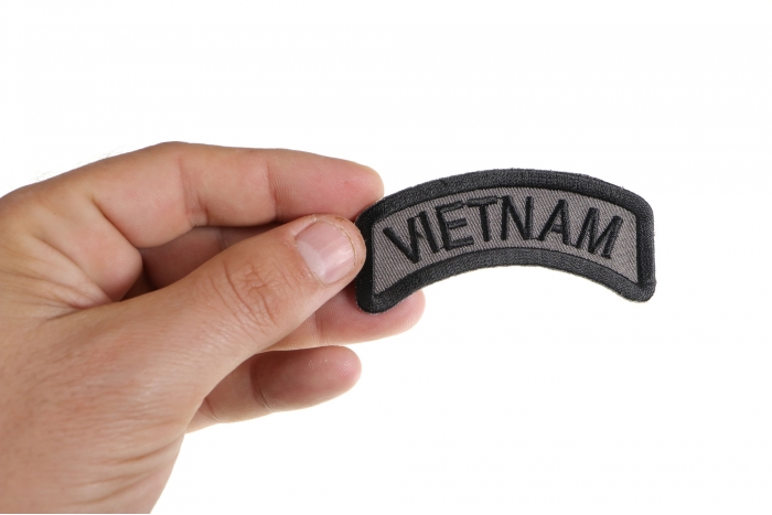 Vietnam Rocker Patch shown on hand for size comparison