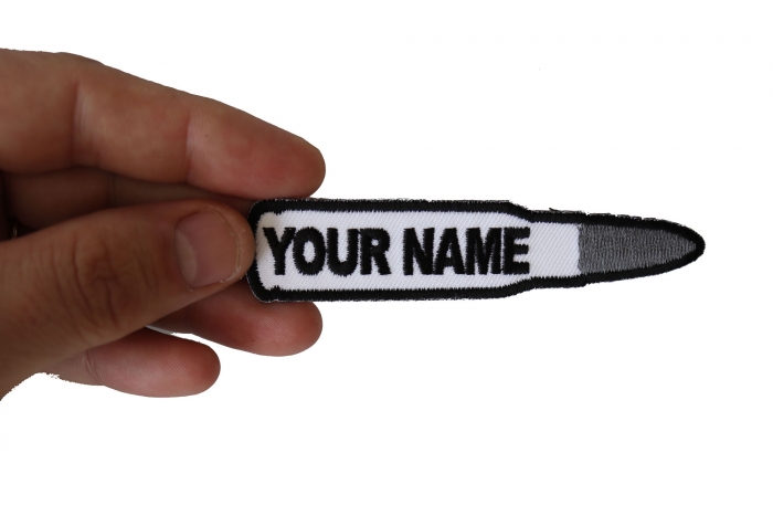 Bullet With Your Name On It Military Morale Patch shown on hand for size comparison